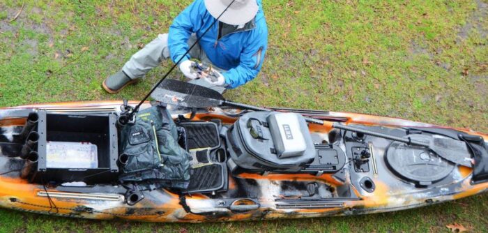 Angler standing confidently on stable fishing kayak platform