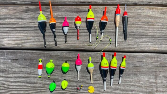 Close-up of colorful fishing bobbers attached to fishing line for bite detection