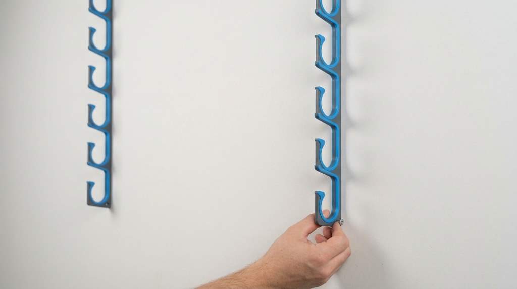 Angler mounting black polymer Plusinno H5P rod holder rail to garage wall framing stud.